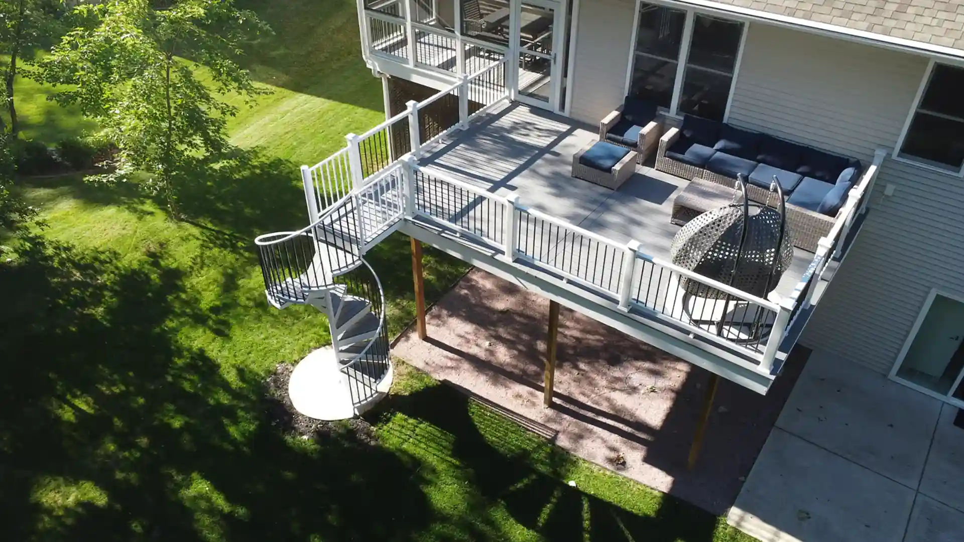 photo of elevated deck with spiral staircase - Custom deck builders in Dane County WI greater madison area