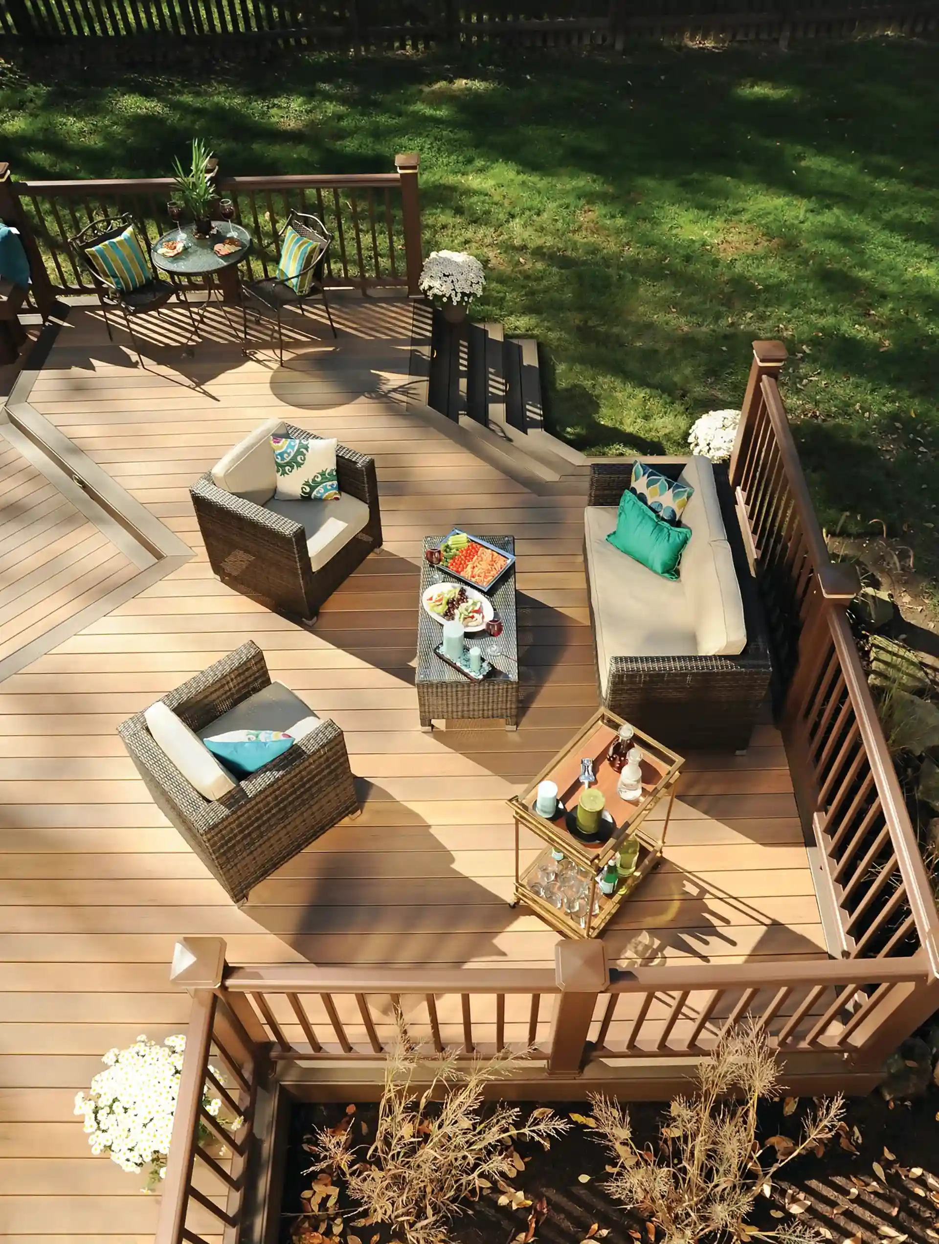 photo of a custom deck with outdoor furniture and deck steps 