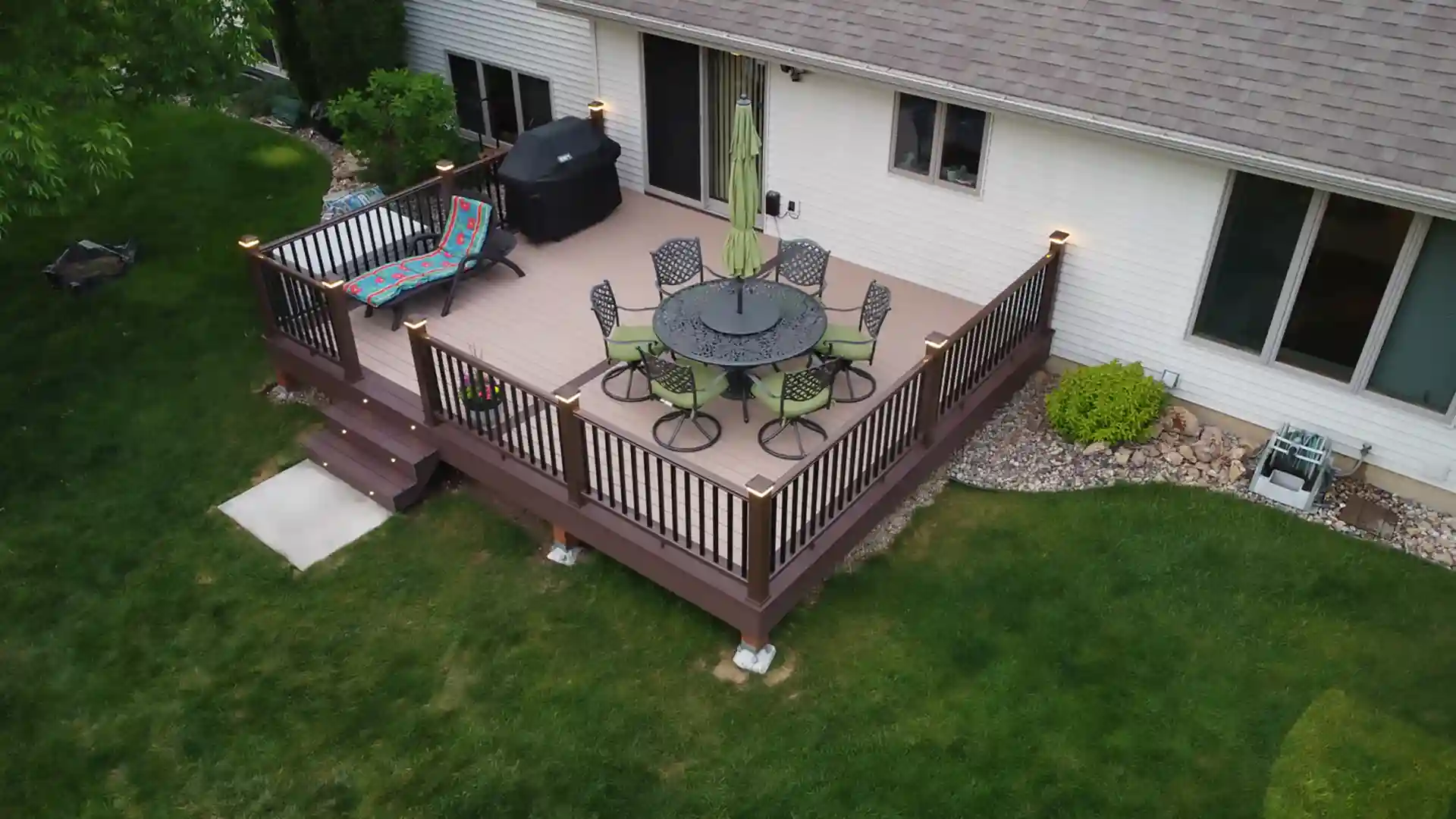 photo of deck with deck railing and deck lighting 